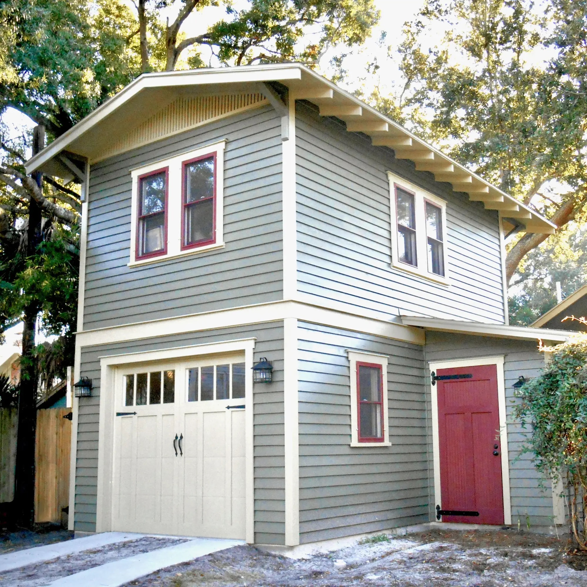Craftsman garage reference with gray-green siding and red trim